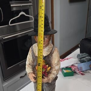 Source Unknown Rustic Figurine with Black Hat and Colorful Flowers